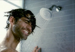 Man showering with Kohler Moxie